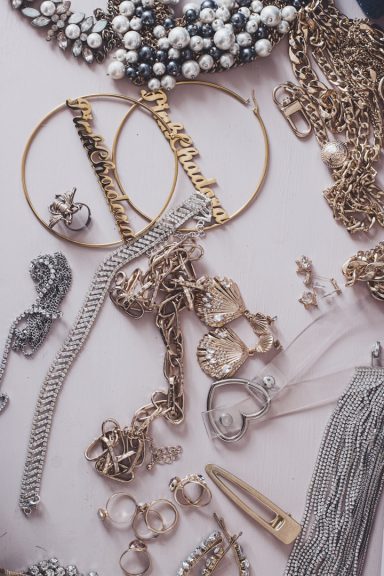 pile of high end jewlery on a light colored background
