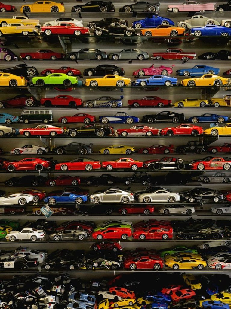 a display with hundreds of hotwheels being showcased